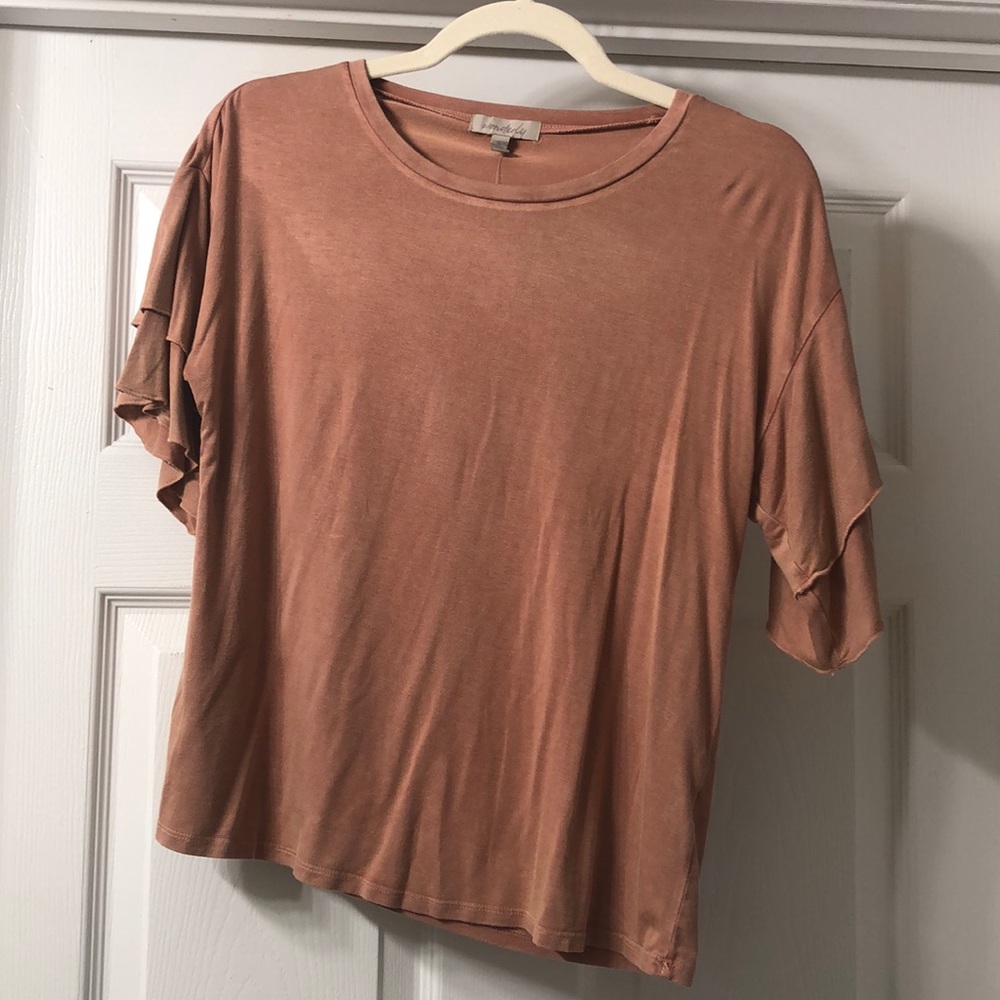 Salmon/peach colored top with ruffle sleeves
